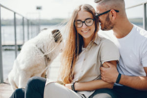 couple relaxing with dog trying to make ivf easier